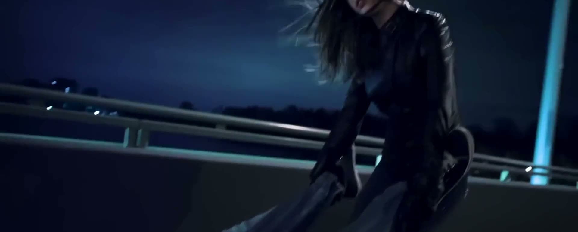 A woman on a bridge at night, the first shot of a cut from the studio's work