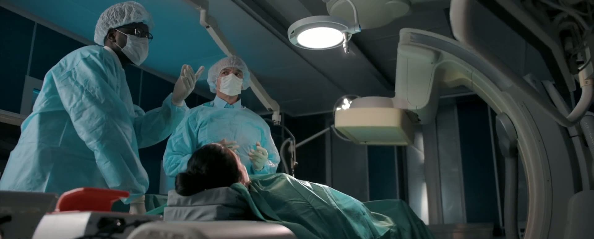 Still from a medical film: surgeons in an operating room